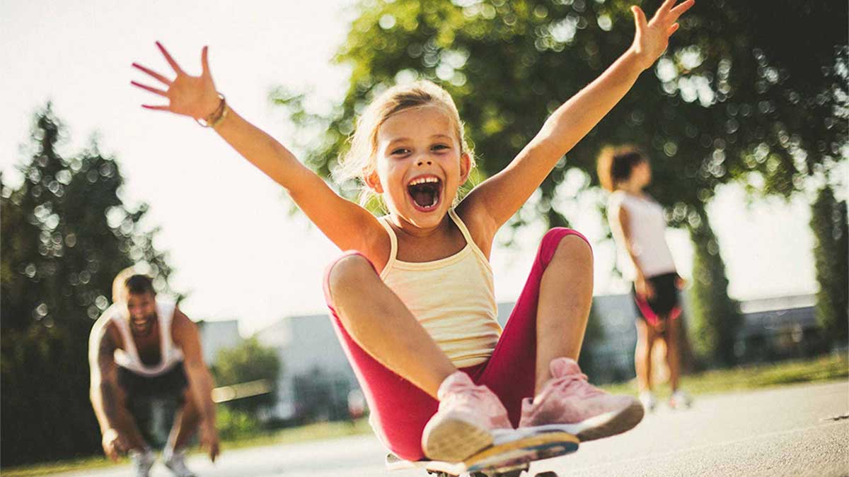 Mum and young boy smiling on a swing – Joyful bonding moment, natural and carefree.